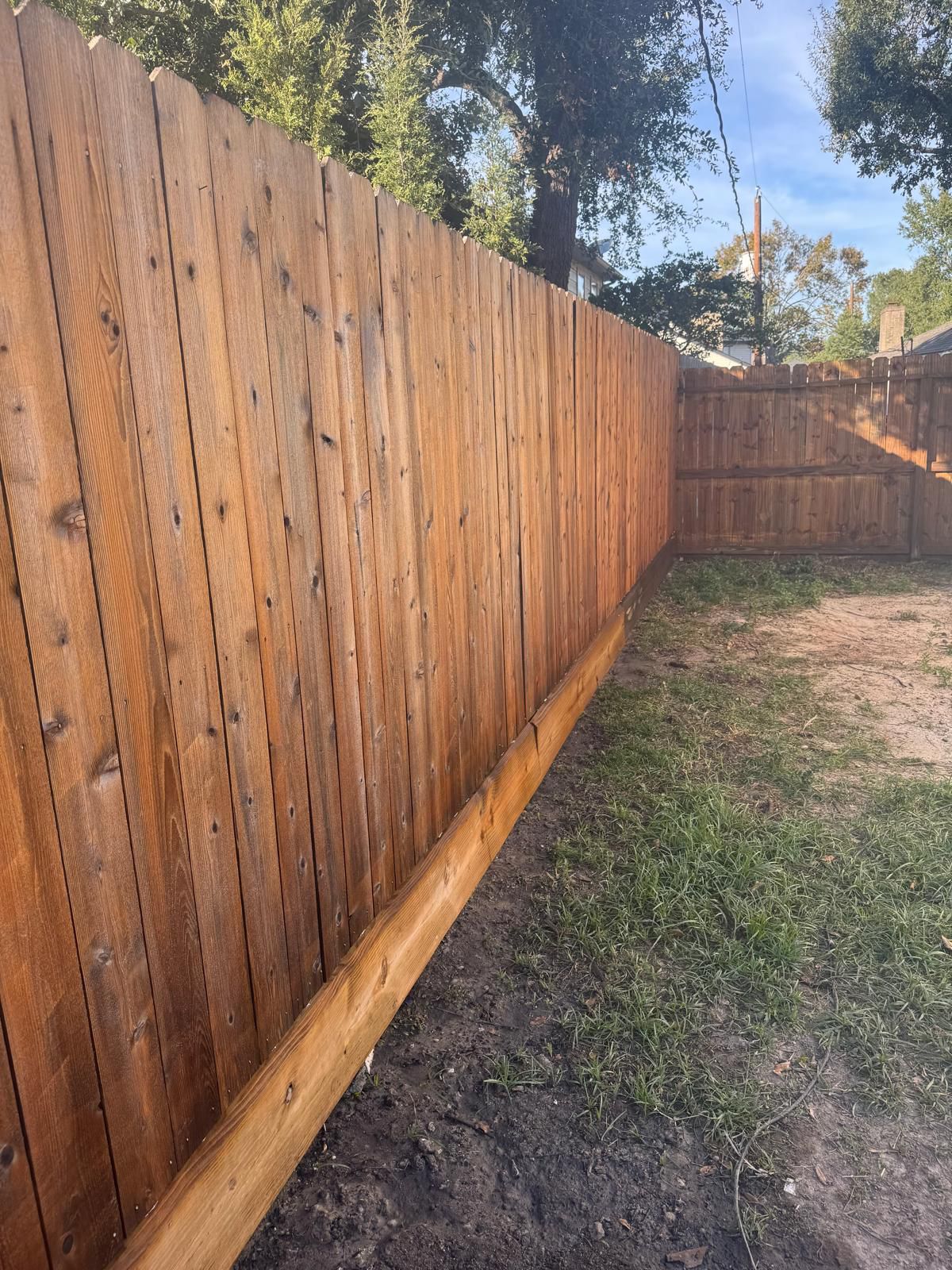 Brown stained wood fence after painting
